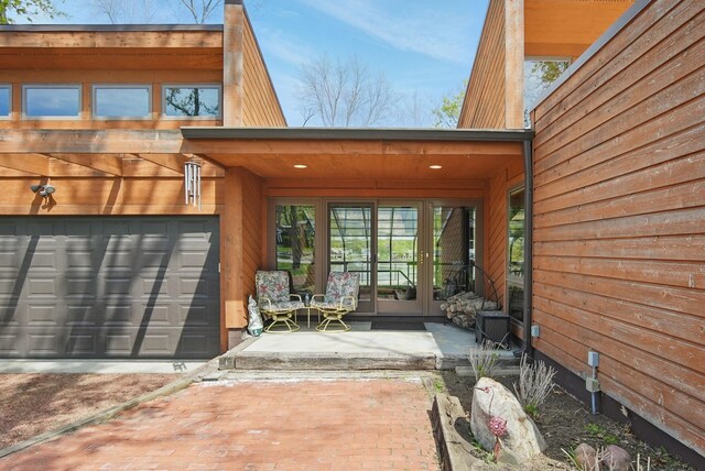 6252 Panorama Dr, Panora, IA 50216 - entrance to property with french doors, a garage, and driveway