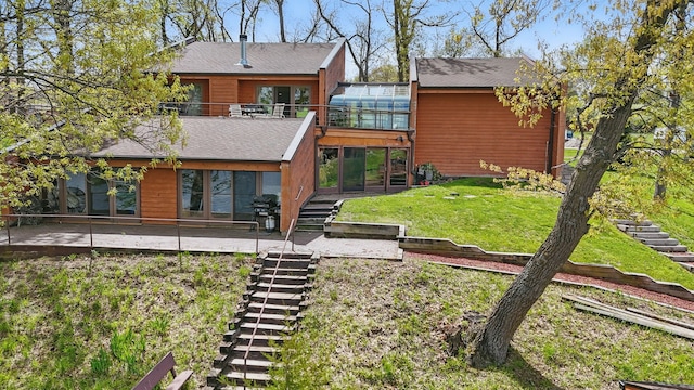 6252 Panorama Dr, Panora, IA 50216 - rear view of property featuring stairs, a patio, a yard, and a shingled roof