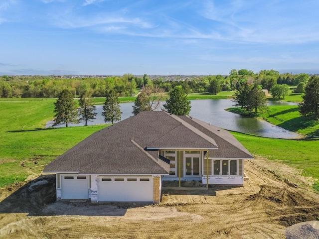 17406 Oakwood Dr, Urbandale, IA 50322 - view of front of home featuring a water view, a shingled roof, a front lawn, an attached garage, and driveway