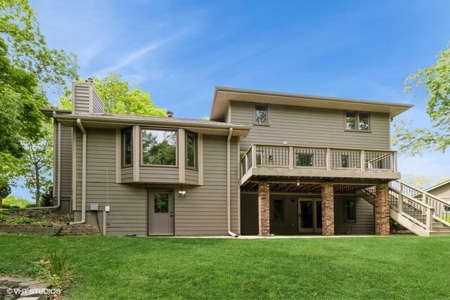 6406 Theresa Dr, Johnston, IA 50131 - back of property with a chimney, a deck, a lawn, and stairs