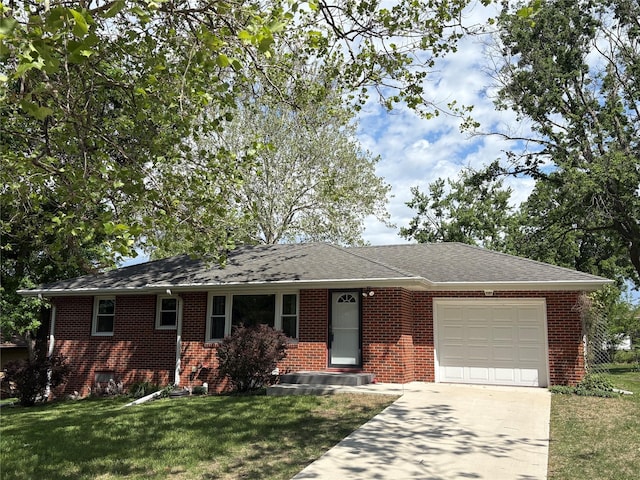 single story home featuring a garage, concrete driveway, brick siding, a front lawn, and a shingled roof