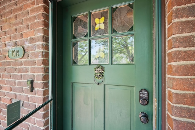 1919 Arlington Ave, Des Moines, IA 50314 - doorway to property with brick siding