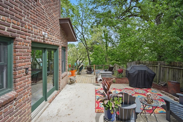 1919 Arlington Ave, Des Moines, IA 50314 - wooden terrace featuring fence and a grill