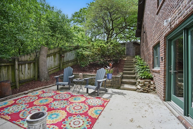 1919 Arlington Ave, Des Moines, IA 50314 - view of patio with stairs and fence