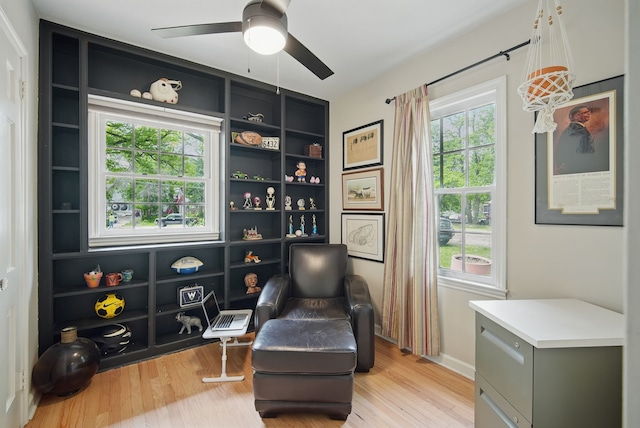 1919 Arlington Ave, Des Moines, IA 50314 - living area featuring a ceiling fan and light wood-type flooring