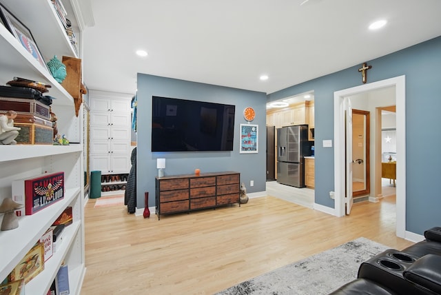 1919 Arlington Ave, Des Moines, IA 50314 - living room featuring light wood finished floors, recessed lighting, and baseboards