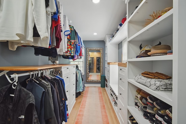 1919 Arlington Ave, Des Moines, IA 50314 - walk in closet featuring light wood finished floors