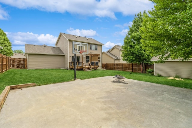 back of house with an outdoor fire pit, a patio area, and a deck