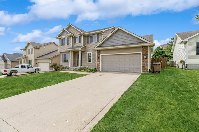 view of front of home featuring an attached garage, a front yard, stone siding, driveway, and a residential view