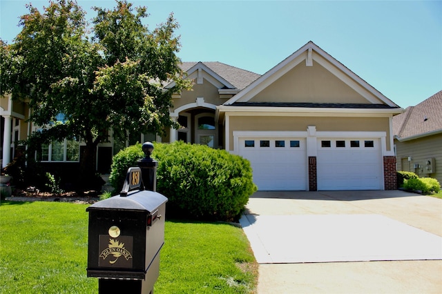 858 Burr Oaks Dr, West Des Moines, IA 50266 - view of front facade featuring driveway, an attached garage, a front lawn, brick siding, and stucco siding