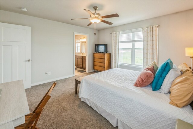 217 NE Glendale Ln, Ankeny, IA 50021 - carpeted bedroom featuring baseboards, a ceiling fan, and ensuite bath