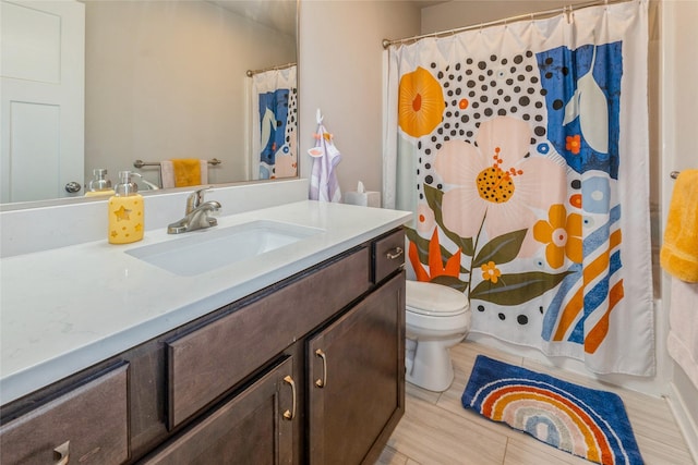 217 NE Glendale Ln, Ankeny, IA 50021 - bathroom featuring vanity, toilet, and a shower with shower curtain
