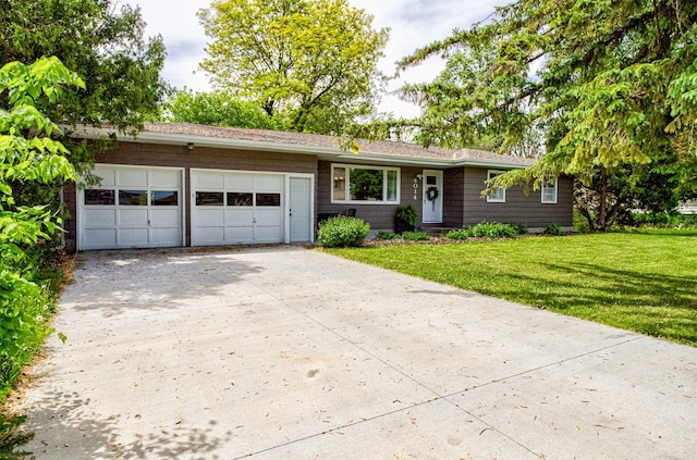 4014 Aplin Rd, Ames, IA 50014 - single story home with concrete driveway, an attached garage, and a front yard