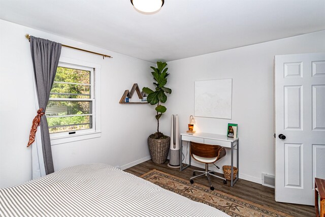 4014 Aplin Rd, Ames, IA 50014 - bedroom featuring dark wood-type flooring and baseboards