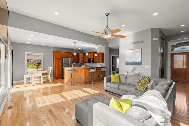 913 SE Trail Ridge Rd, Grimes, IA 50111 - living area featuring ceiling fan, light wood-type flooring, recessed lighting, and baseboards
