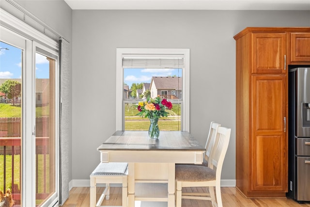 913 SE Trail Ridge Rd, Grimes, IA 50111 - dining area with light wood finished floors and baseboards