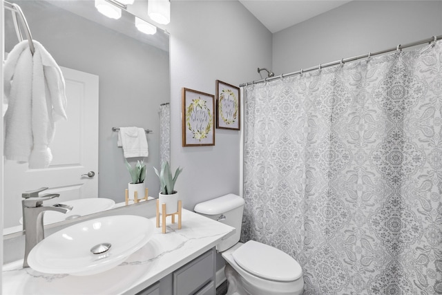 913 SE Trail Ridge Rd, Grimes, IA 50111 - bathroom featuring vanity, toilet, and a shower with shower curtain