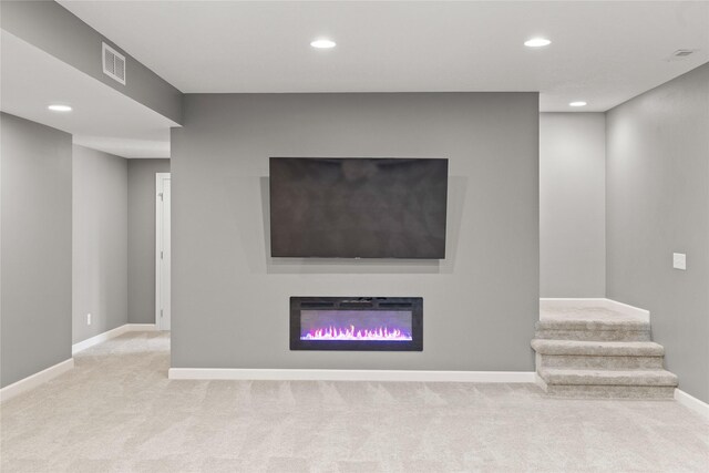913 SE Trail Ridge Rd, Grimes, IA 50111 - unfurnished living room with carpet flooring, baseboards, and recessed lighting