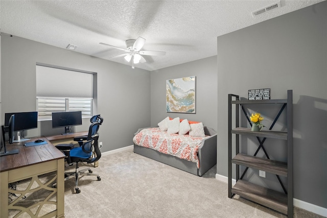 913 SE Trail Ridge Rd, Grimes, IA 50111 - bedroom with an office area, carpet, baseboards, a textured ceiling, and a ceiling fan