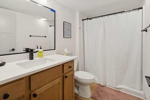 585 NW Rosemont Dr, Waukee, IA 50263 - bathroom featuring vanity, wood finished floors, and a shower with shower curtain