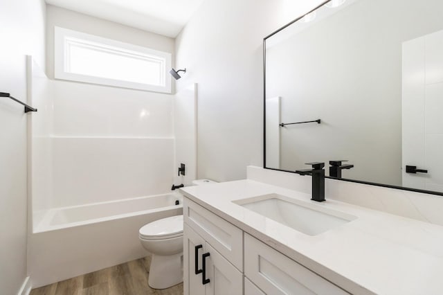 14512 Northpark Dr, Urbandale, IA 50111 - full bathroom featuring toilet, wood finished floors, bathtub / shower combination, and vanity