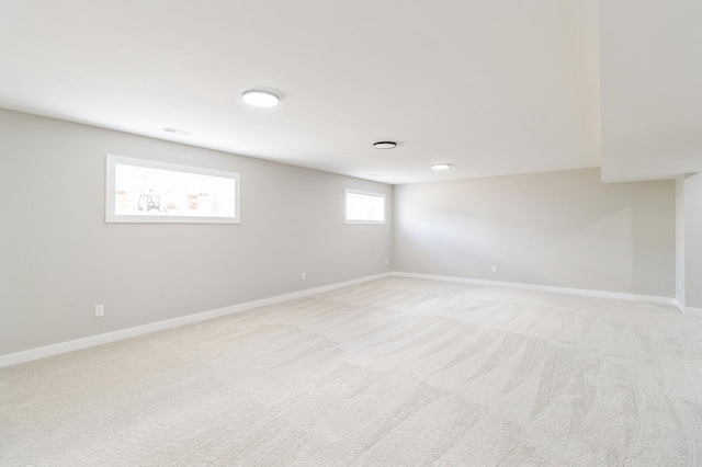 14512 Northpark Dr, Urbandale, IA 50111 - basement featuring light colored carpet and baseboards