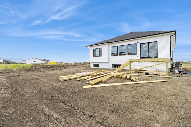 14512 Northpark Dr, Urbandale, IA 50111 - rear view of property with a shingled roof