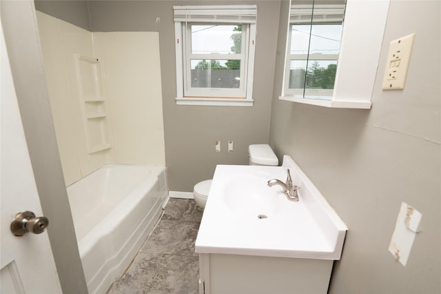 101 E Cronkhite St, Knoxville, IA 50138 - bathroom featuring toilet, vanity, baseboards, and shower / bathtub combination