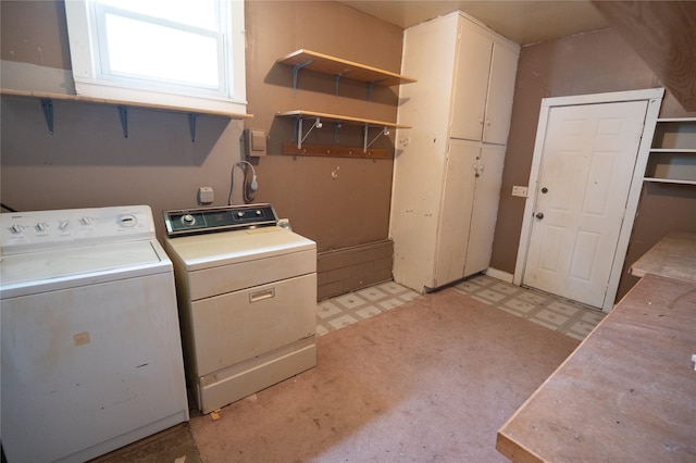 101 E Cronkhite St, Knoxville, IA 50138 - laundry area with light floors, washing machine and dryer, and cabinet space