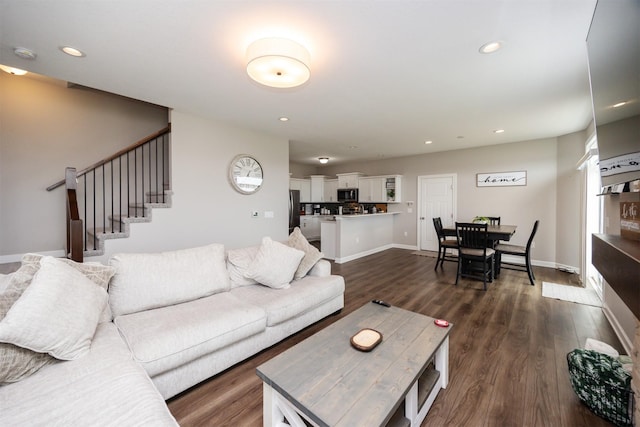 675 SE Maxwell Dr, Waukee, IA 50263 - living room with dark wood-style flooring, stairway, and recessed lighting