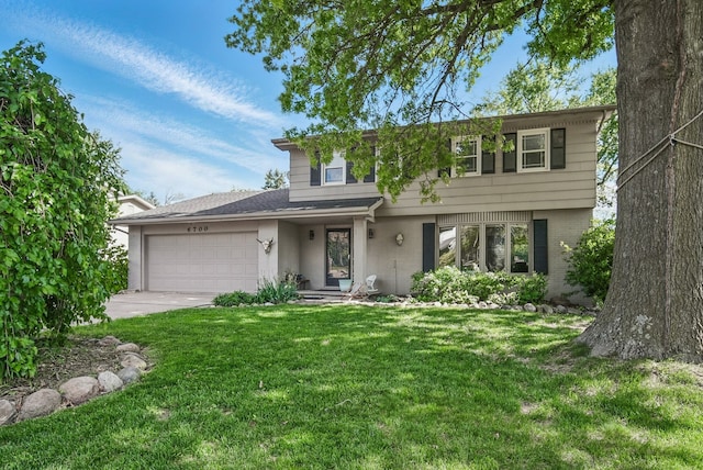 6700 Sheridan Ave, Des Moines, IA 50322 - view of front of home with an attached garage, a front lawn, concrete driveway, and brick siding