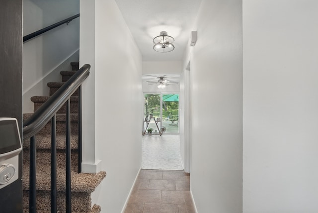 6700 Sheridan Ave, Des Moines, IA 50322 - corridor featuring stairs and baseboards