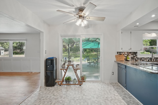 6700 Sheridan Ave, Des Moines, IA 50322 - kitchen featuring tasteful backsplash, white cabinets, white electric stovetop, a ceiling fan, and recessed lighting