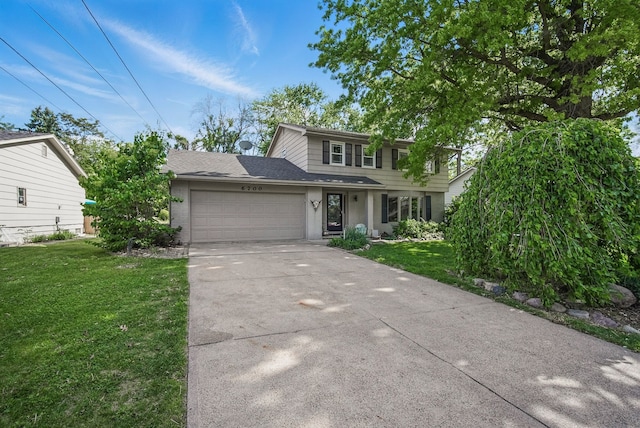 6700 Sheridan Ave, Des Moines, IA 50322 - view of front of home featuring an attached garage, a front lawn, and concrete driveway