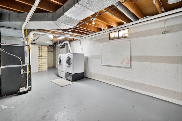 6700 Sheridan Ave, Des Moines, IA 50322 - unfinished below grade area featuring washer and dryer and heating unit