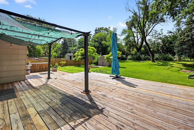 6700 Sheridan Ave, Des Moines, IA 50322 - deck with a storage shed and view of scattered trees