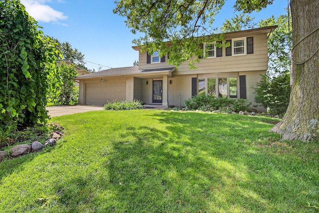 6700 Sheridan Ave, Des Moines, IA 50322 - view of front of property with an attached garage, concrete driveway, and a front yard