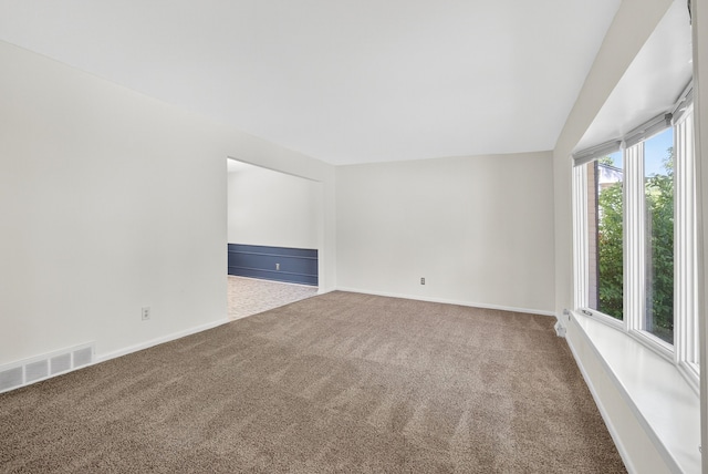 6700 Sheridan Ave, Des Moines, IA 50322 - unfurnished room with carpet flooring and vaulted ceiling