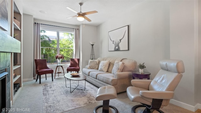 201 Grand Ave Unit 109, Des Moines, IA 50309 - living room with carpet floors, baseboards, and ceiling fan