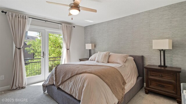 201 Grand Ave Unit 109, Des Moines, IA 50309 - bedroom with access to outside, light colored carpet, baseboards, wallpapered walls, and ceiling fan