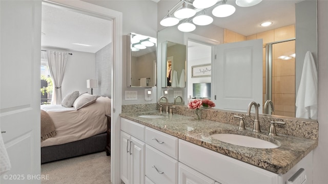 201 Grand Ave Unit 109, Des Moines, IA 50309 - full bath with connected bathroom, a shower stall, and double vanity