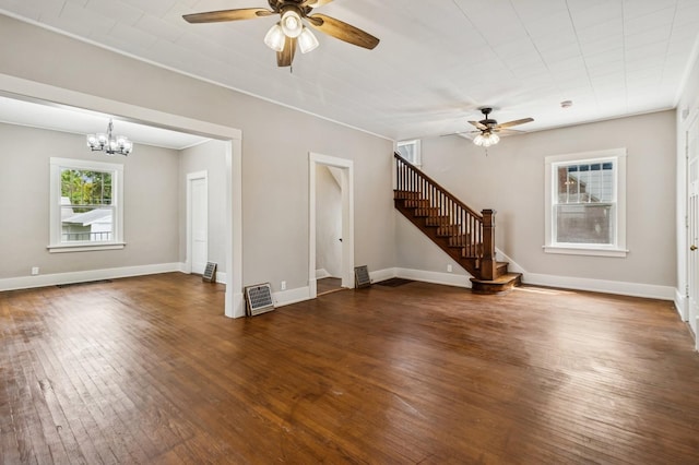 693 35th St, Des Moines, IA 50312 - unfurnished living room featuring a ceiling fan, stairs, wood-type flooring, and a chandelier
