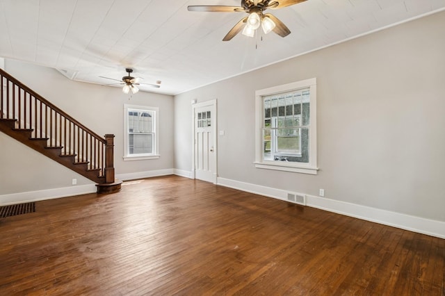 693 35th St, Des Moines, IA 50312 - entrance foyer with a ceiling fan, hardwood / wood-style flooring, stairs, and baseboards