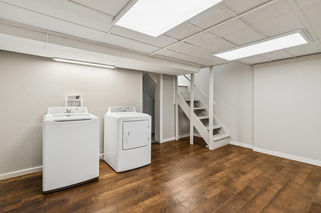 693 35th St, Des Moines, IA 50312 - washroom featuring washing machine and dryer, wood finished floors, and baseboards