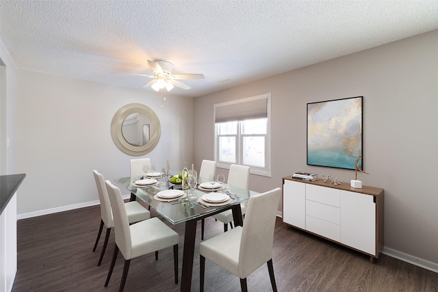 1240 49th St Unit 5, West Des Moines, IA 50266 - dining area featuring dark wood-type flooring, ceiling fan, baseboards, and a textured ceiling