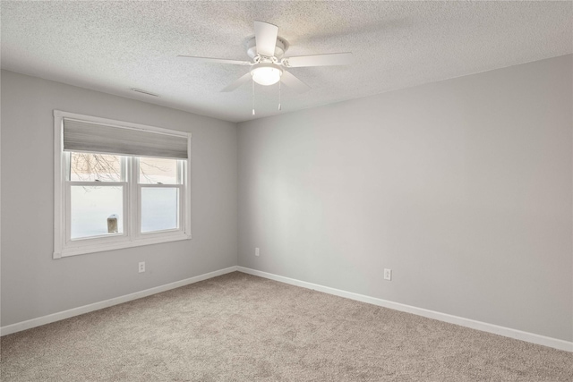 1240 49th St Unit 5, West Des Moines, IA 50266 - carpeted spare room with ceiling fan, baseboards, and a textured ceiling