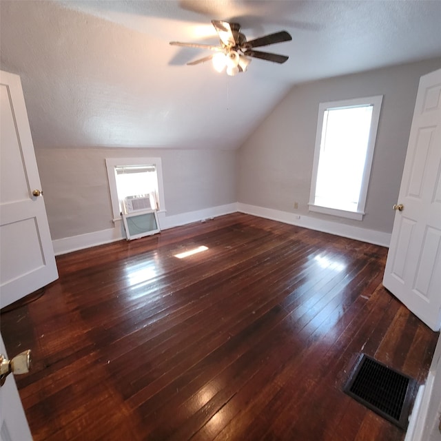 2540 Capitol Ave, Des Moines, IA 50317 - additional living space with lofted ceiling, ceiling fan, wood-type flooring, and baseboards