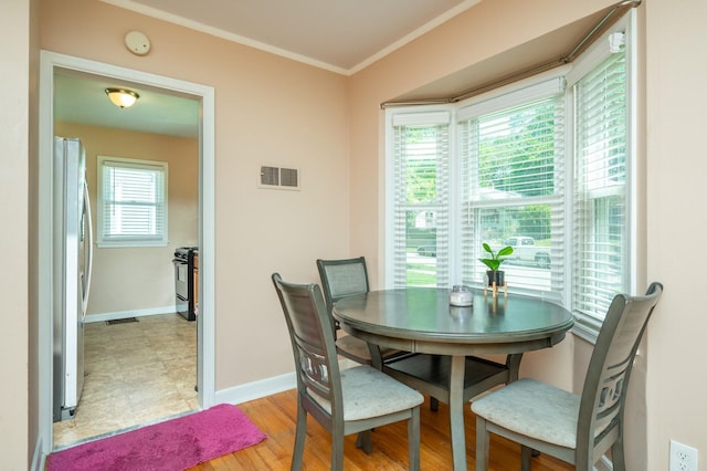 2326 E 11th St, Des Moines, IA 50316 - dining area with ornamental molding and baseboards