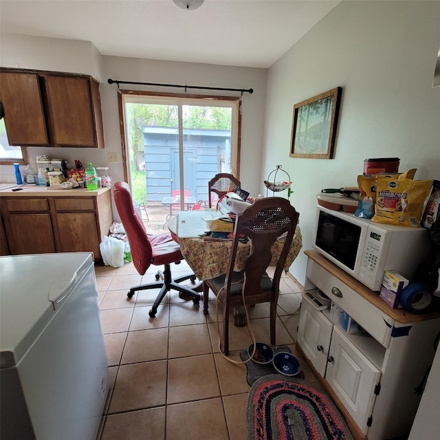 1850 King Ave, Des Moines, IA 50320 - dining area with a desk and light tile patterned floors