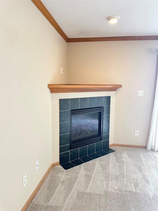 10141 Sutton Dr Unit 7, Urbandale, IA 50322 - detailed view of carpet flooring, crown molding, a fireplace, a textured ceiling, and baseboards